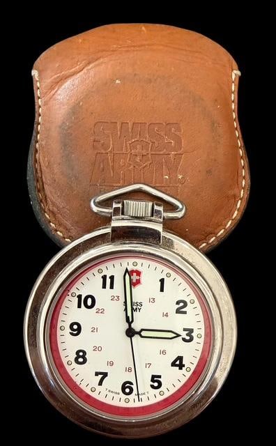 Vintage Swiss Army Pocket Watch in Leather Case: Vintage Swiss Army pocket watch in leather case. Watch measures 2" across. Case measures 2.25" x 2.75".