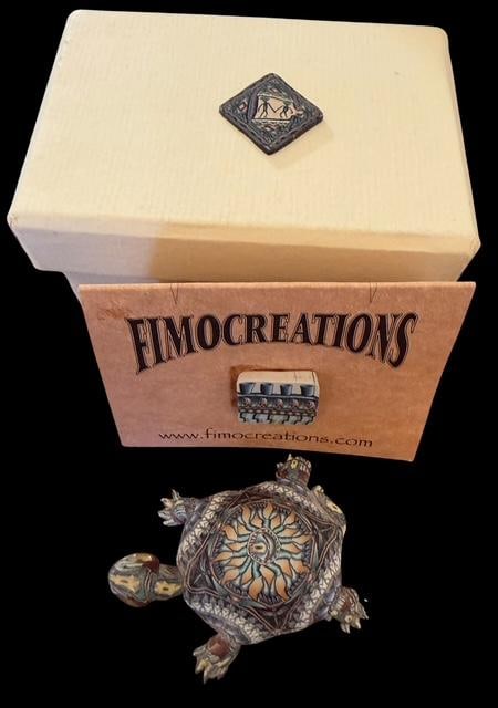 FIMO Polymer Clay Turtle by Jon Anderson: FIMO polymer clay turtle in original box with tag. Signed JA - Jon Anderson. Measures 2" x 1" x 1.5".