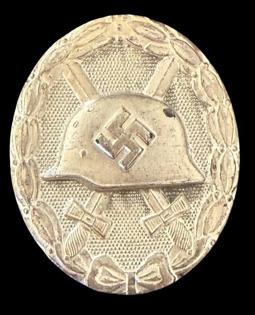 WWII German Silvertone Wound Badge: WWII German silvertone wound badge. Ca 1939. Measures 1.75" x 1.25".