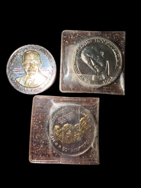 Lot of Three Commemorative Silvertone Tokens: Lot of three commemorative silver-tone tokens. 1) Mt. Rushmore. 2) Eisenhower 40th Anniversary of Normandy landing 1984. 3) Franklin Roosevelt 100th Anniversary of birth 1882-1982. Each measure 1.5" a