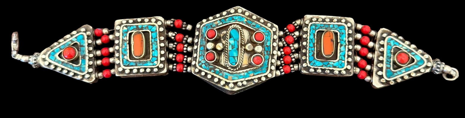 Silvertone Bracelet with Inlaid Coral and Turquoise: Silvertone bracelet with inlaid coral and turquoise stones. Weighs 56g and measures 7" long.