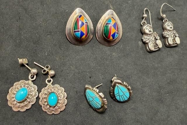 Four Pair of Native American Earrings: Four pair of Native American (Navajo/Zuni) pierced earrings. 1) Storyteller design. Marked sterling. Measures 1" x .5" and weighs 8g. 2) Marked sterling and inlaid with lapis, turquoise and coral. Mea