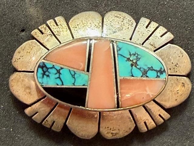 Native American Navajo Signed TO Sterling and Stone Brooch: Native American Navajo brooch with stone inlay. Marked sterling and signed TO. Inlaid with turquoise, rose quartz and onyx. Weighs 13.5g. Measures 1.5" x 1".