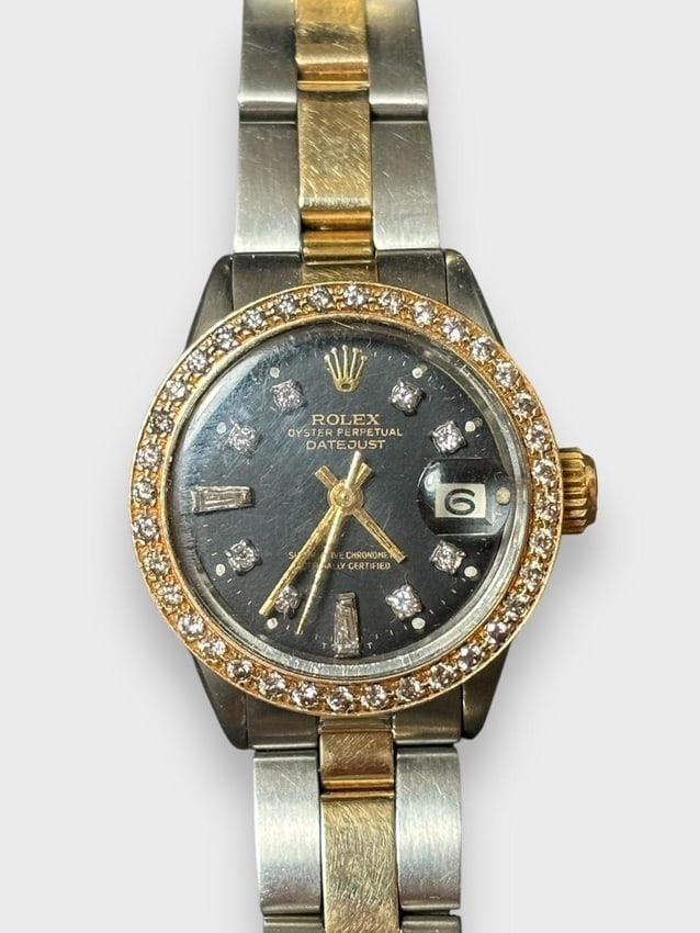 Women's Rolex Watch 18K Gold with Diamonds Includes GAI Appraisal: Women's Rolex watch with diamond accents. Total carat weight - 2 carat. 18k gold and stainless band. Includes GAI Report with appraisal of $14,995. Face 1" diameter, when fully open approximately 9" c