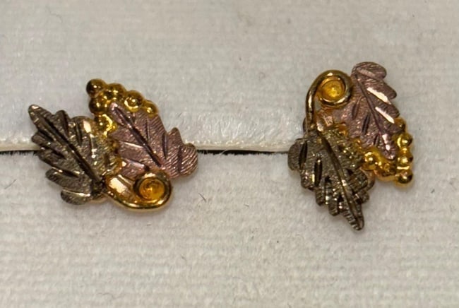 14K Black Hills Gold Earrings: 14K Black Hills gold pierced earrings. White and yellow gold in leaf design. Weighs 1.2g.