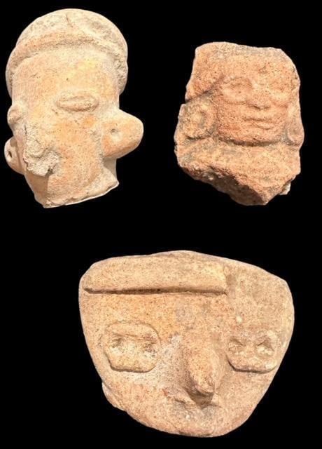 Pre-Columbian Lot of Three Carved Faces 1200 CE: Pre Columbian, ca 1200 AD, lot of three carved humanistic faces. Very nice condition. Quarter shown for scale. Museum of Man San Diego, Ca.
