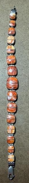 Sterling and Carnelian Agate Bracelet: Sterling and carnelian agate bracelet. Marked .925. Total weight 20g. Measures 7" unclasped.