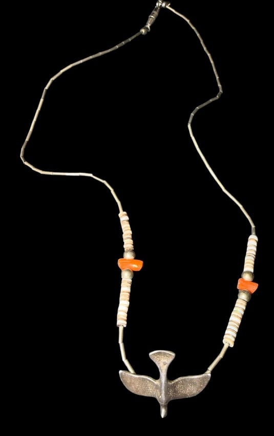 Native American Liquid Silver and Sterling Bird Pendant Necklace: Native American liquid silver pendant necklace with shell and coral beads. Sterling bird pendant measures 1" x .5". Necklace measures 16" and total weight 5g.