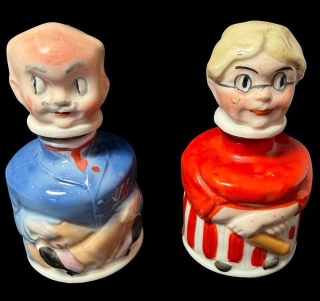 Pair of German Porcelain Figural Inkwells: Pair of German figural inkwells. Made in Germany for Carters. Grandmother and Grandfather figures. Measures 4" tall by 2.25" wide.