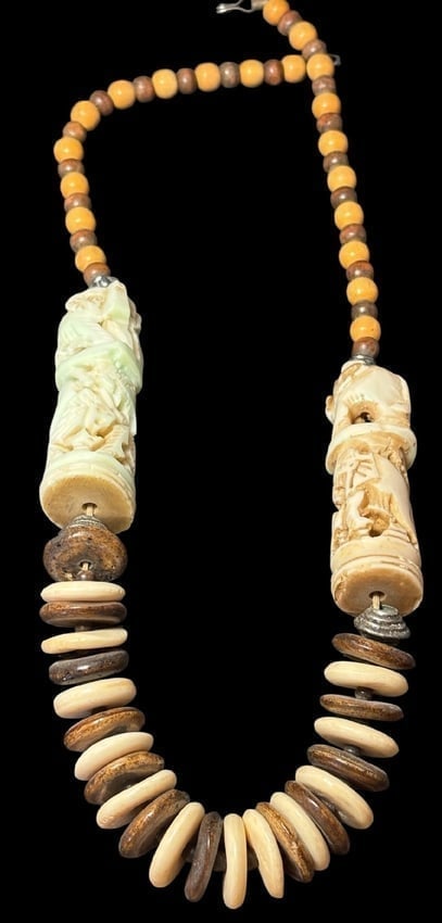 Tibetan Tribal Guardian Carved Bone Necklace: Tibetan tribal village guardian necklace made of wooden beads and carved bone. Elephant design. Measures 24".
