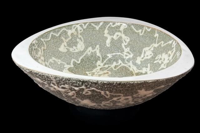 Mid-Century Japanese Pottery Dish: Mid Century Japanese pottery footed bowl. Paper label still attached. Made in Japan on base. Measures 3" tall by 6.75" wide.