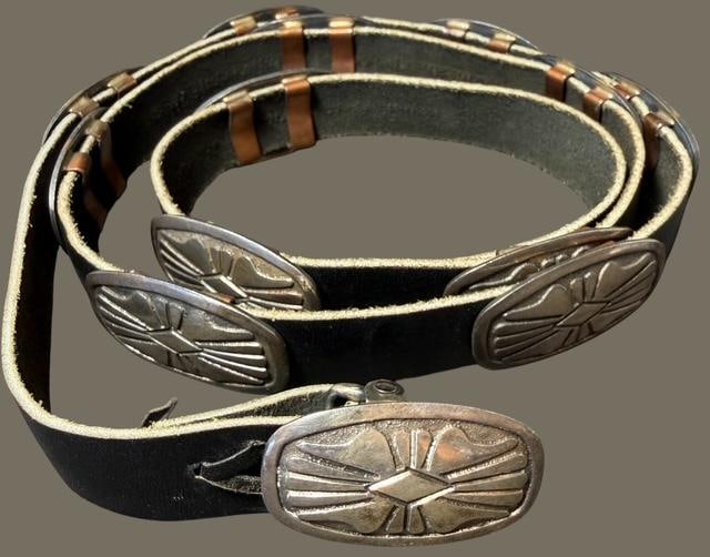 Native American Navajo Sterling and Leather Concho Belt Signed SB: Native American Navajo sterling and leather concho belt. Signed SB. Nice pattern on oval conchos that measure 1.75" x 1". Leather strap is new with no holes. Conchos weigh aproximately 13g each. Buckl