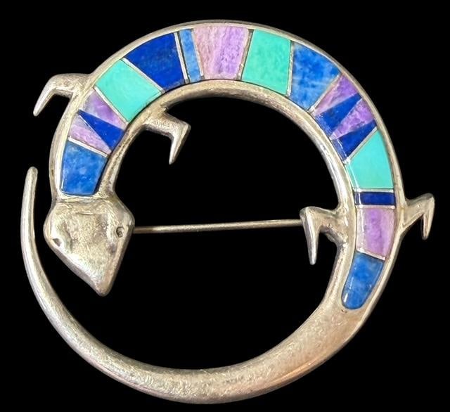 Native American Zuni Sterling and Inlaid Stone Lizard Shaped Brooch Signed Smith & TSF: Native American Zuni lizard shaped pin. Inlaid with turquoise and lapis. Signed TSF and Smith. Weighs 1.75" across and total weight is 15g.