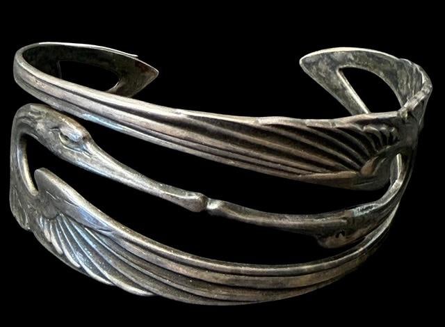 Sterling Stylized Stork Cuff Bracelet Art Deco Style: Sterling cuff bracelet. Stylized stork design. Marked sterling, .925. Measures 6.25" around with a 1.25" cuff opening. Weighs 20g.
