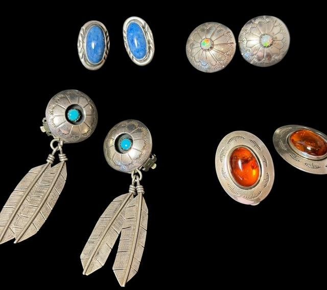 Lot of Native American Sterling and Stone Clip On Earrings: Lot of four vintage Native American sterling and stone clip-on earrings. 1) Lapis stone - measures .25" x .5". 2) Dangle feather and turquoise stone. Measures 2.5" x .75". 3) Amber stone with Zia symb