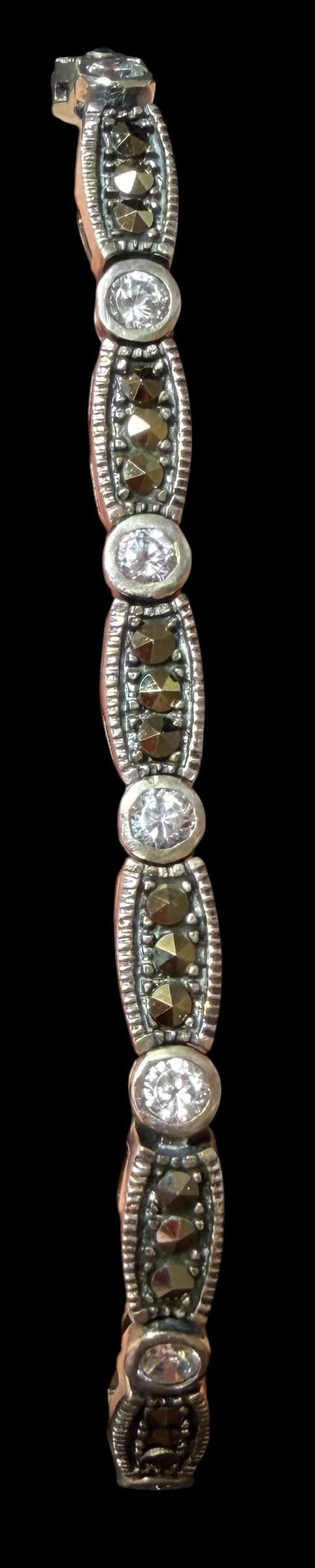 Merona Tennis Bracelet: Merona tennis bracelet with cubic zirconia's and marcasite stones. Still has original tag. Never worn. Measures 7" and weighs 13g.