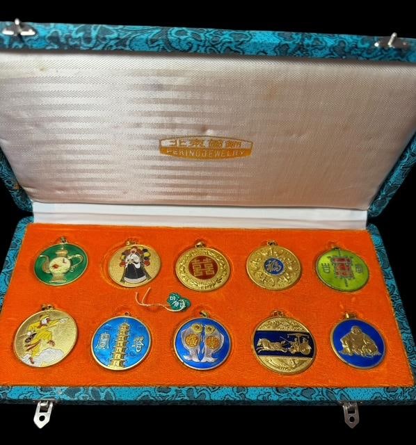 Enamal Peking Jewelry Medallion Pendants: Enamel Peking jewelry medallions. Gold tone. Set of 10 in original box with tag. Each medallion measures 1.5" across. Box measures 10.5" x 5.5" x 1".