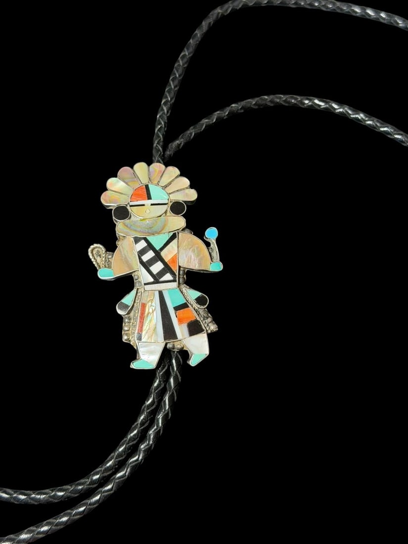Native American Zuni Dancer Sterling and Stone Bolo Tie Signed Latio Leon: Native American Zuni Dancer sterling and stone inlay bolo tie with sterling tips. Bolo inlaid with turquoise, mother of pearl, spiny oyster and onyx. Signed Latio Leon. Bolo measures 1.75" x 3" on a 3