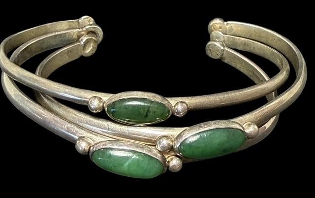 Lot of Three Native American Sterling and Jasper Stone Cuff Bracelets: Lot of three Native American sterling and jasper stone cuff bracelets. Marked sterling. Measures 6" around with a 1" gap opening. Total weight 28g.
