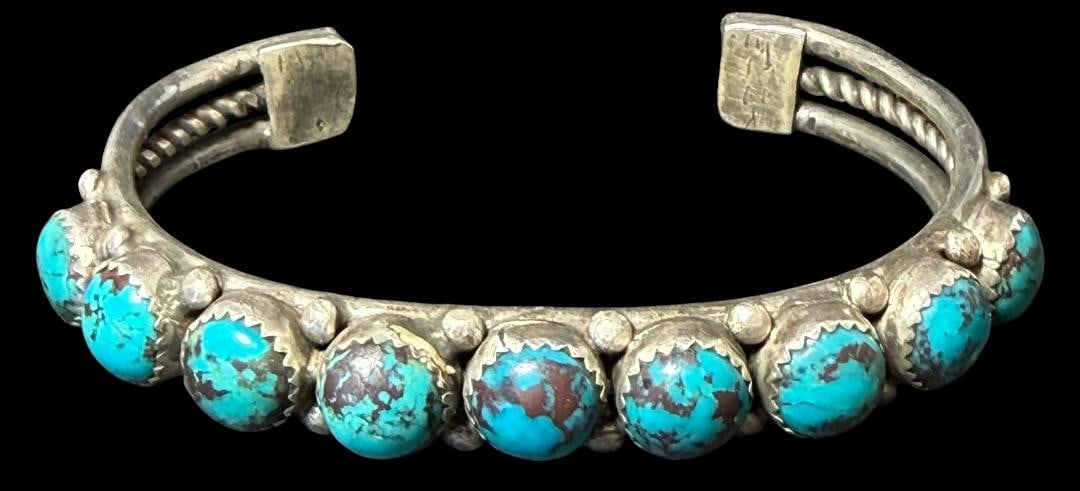 Native American Sterling and Turquoise Cuff Bracelet: Native American sterling (tested) and turquoise cuff bracelet. Signed - unable to decipher signature - see photos. Measures 6" around with a 1.25" cuff opening. Total weight 31g.