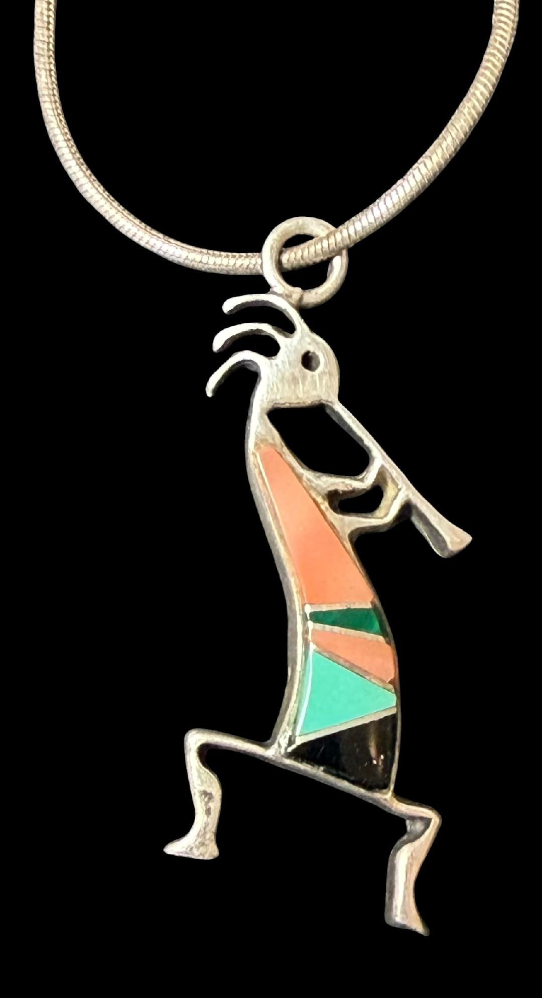 Native American Navajo Sterling Pendant Necklace: Native American Navajo sterling Kokopelli pendant necklace. Marked sterling. Chain measures 19". Pendant measures .5" x 1.5". Total weight 7g.