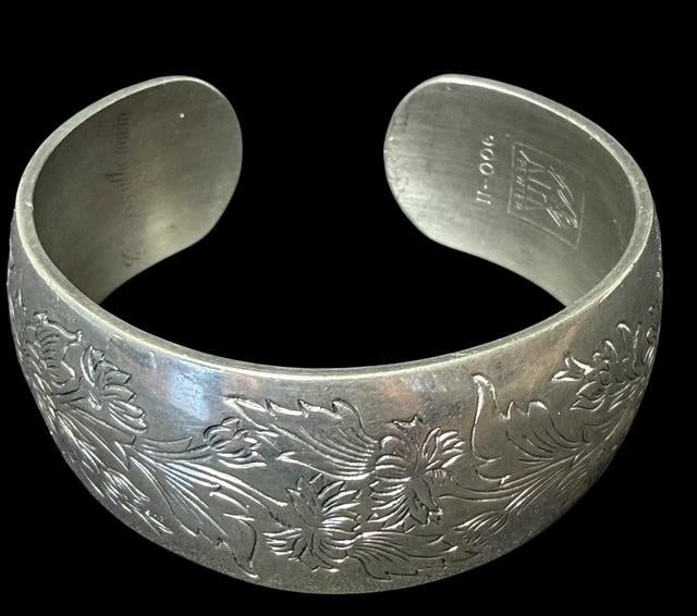 Kirk Pewter Signed Cuff Bracelet: Cuff bracelet. Stamped Kirk Pewter, 900H and Chrysanthemum. Measures 6.5" around with a 1" cuff opening. Total weight 42g.