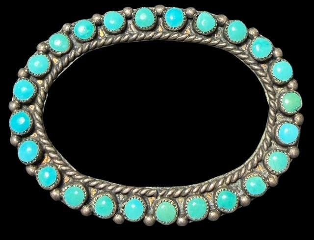Native American Navajo Sterling and Turquoise Brooch: Native American Navajo sterling and turquoise brooch. Measures 1.5" x 1.25" and weighs 5.5g.