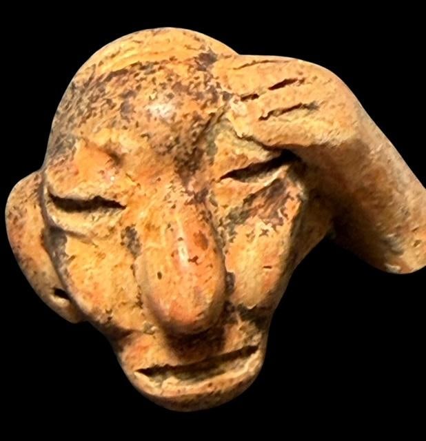 Pre-Columbian Carved Face and Hand 1200 CE: Detail is superb on this carved piece including the face, hand and drilled hole in earlobe. Museum of Man San Diego, Ca. 2"x1.5"x1.5"