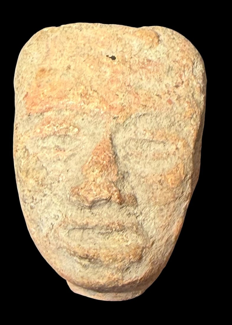 Pre-Columbian Small Carved Human Face 1200 CE: Pre Columbian, ca 1200 AD, human face is nicely carved in this small relic. Museum of Man San Diego, Ca. 1"x1.5"x.5"