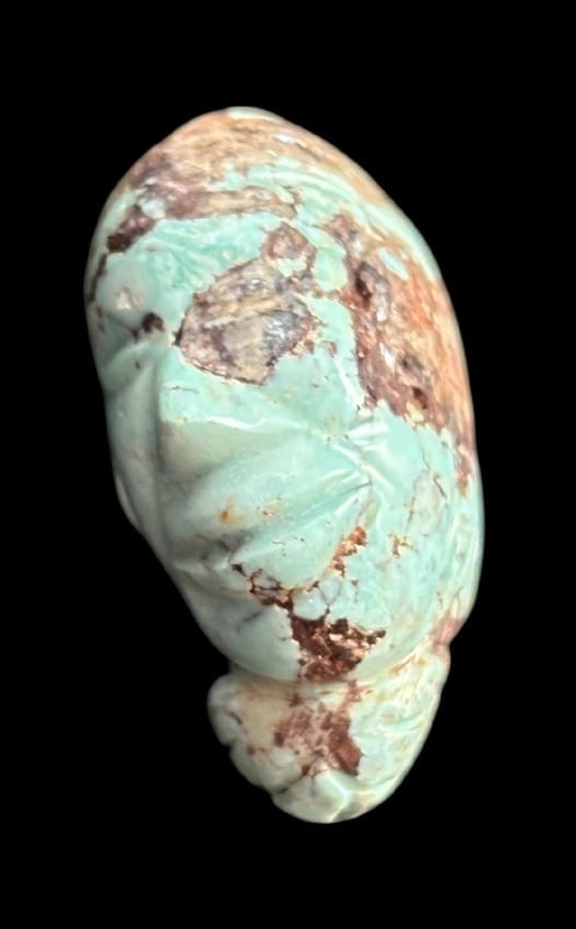 Antique Turquoise Carved Face: Hand carved face in a turquoise stone. Measures 1.25". Region and date unknown