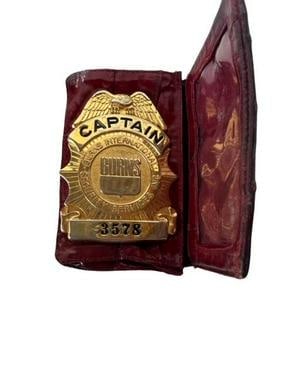 Captain Burns Security Badge In Leather Case: Vintage Burns International Security Services Inc Captain's Badge # 3578 in leather case. Measures 3" by 2".