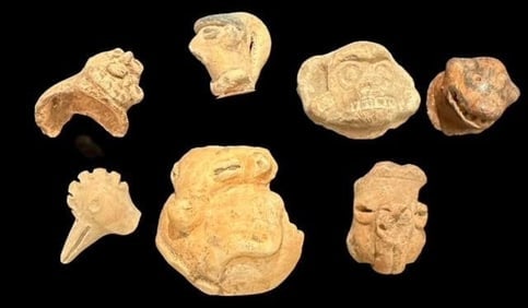 Pre-Columbian Lot of Seven Animal and Human Faces Pottery Pieces 1200 CE: Lot of seven Pre Columbian, ca 1200 AD, pottery pieces depicting both animal and human faces. Quarter shown for scale. Museum of Man San Diego, Ca.