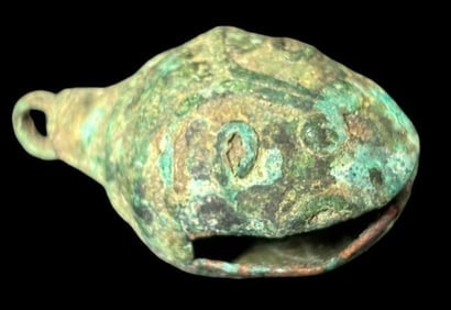 Ancient Copper Bell Tlaloc Deity Face: Ancient copper bell. Estimated 300-500 years old. From ancient nomadic people with Tlaloc Deity Face. Measures 1.5" x .75".