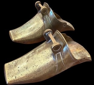 Pair of Brass Conquistador Stirrups: Pair of brass conquistador stirrups. Marked FF35. Ca. 19th century. Measures 11" x 4" x 5".