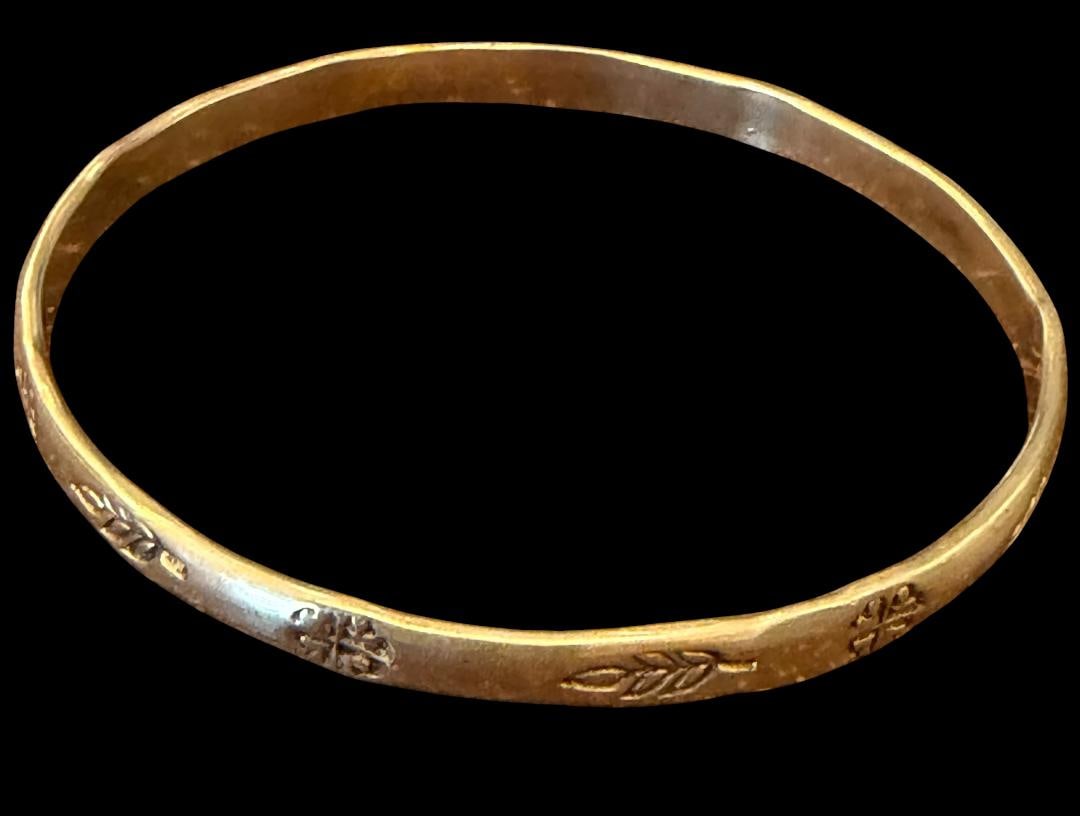 Sterling Mexican Stamped Design Bangle Bracelet: Sterling bangle bracelet with a stamped edge design. Marked Mexico and .925. Weighs 18g.