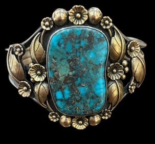 Native American Navajo Signed Carl Luthey 14K, Turquoise and Sterling Cuff Bracelet: Native American sterling, turquoise and 14K yellow gold cuff. Marked sterling with the Carl Luthey hallmark shop icon and hallmark signed for Navajo artist Luke Billy Yazzie and the numerals 2857. Mea