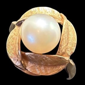 Japanese 14K Gold and Pearl Ring Ca. 1950s: 14K gold ring with pearl center surrounded by gold leaves. Marked Japan. Weighs 4.8g. Size 6.5.