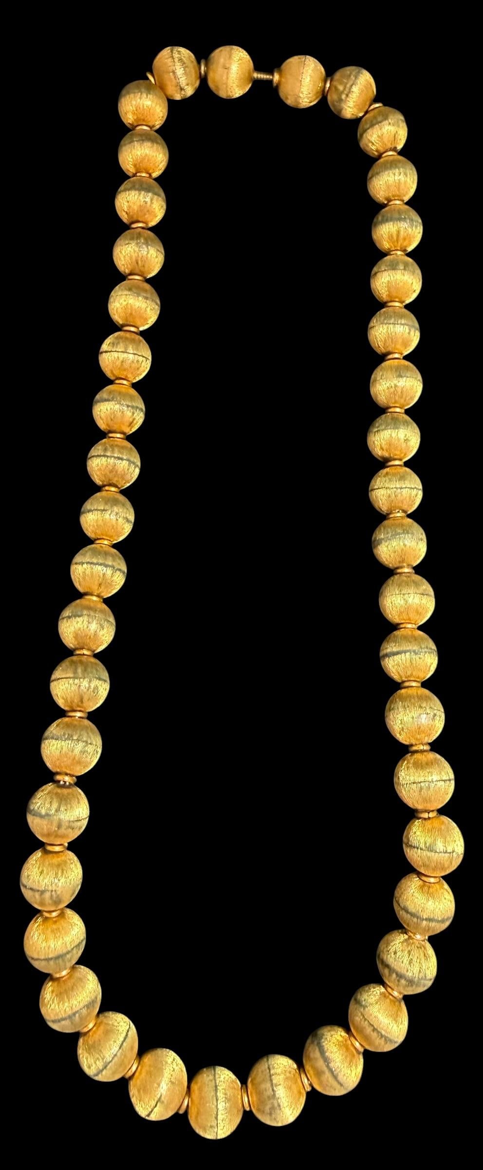 14K Gold Bead Necklace: 14K gold bead necklace. Measures 16". Total weight 39.46g. Marked 14k on screw like bar near bead. See photos.