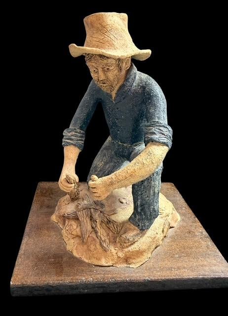 Signed Pottery Cowboy Figure B. Kelly: Signed pottery cowboy figure. Signed B. Kelly and dated '98. Measures 8" tall on a 6.75" x 5.75" base.