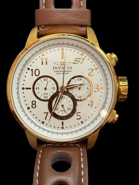 Invicta S1 Mens Sport Watch: Invicta S1 Rally model 16011 men's sports watch. Band is 10" by 1". Watch face is white and is 2" across.
