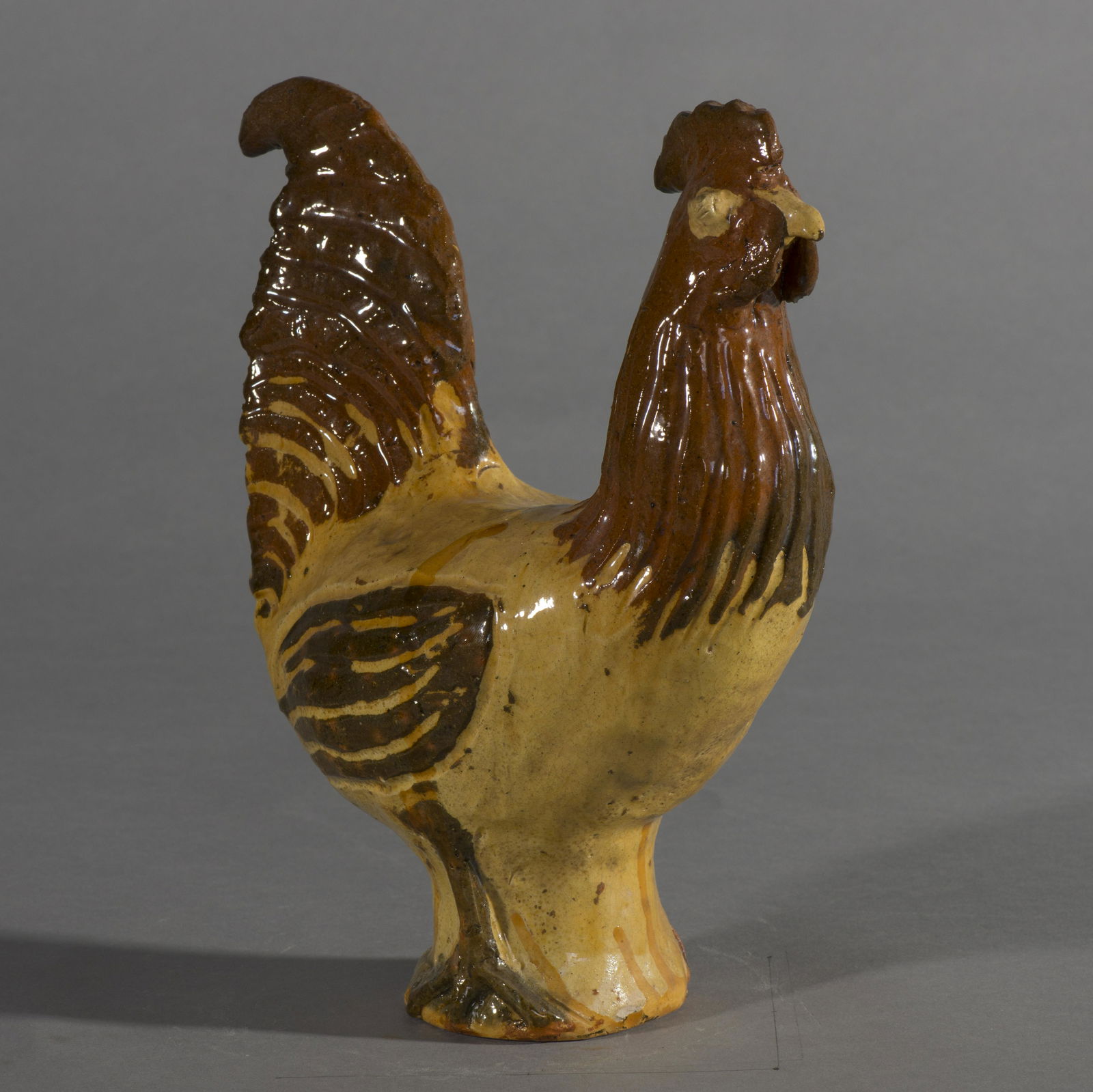 Charles Moore Multi Glaze Rooster 2001: a yellow and brown multi glaze rooster / chicken by Charles Moore signed and dated 2001. A large work, the tallest chicken/rooster in the sale. Condition is excellent. Charles Moore, (1935 -2007) Jugt