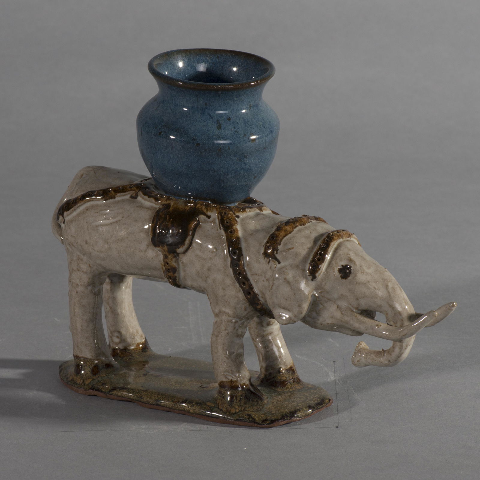 Charles Moore Elephant 1992 Jugtown: a rare rare example of a high glazed animal by Charles Moore is this Elephant with basket on top. Signed on bottom in script Charles Moore with the Jugtown Ware stamp and a stamp date of 1992. A super