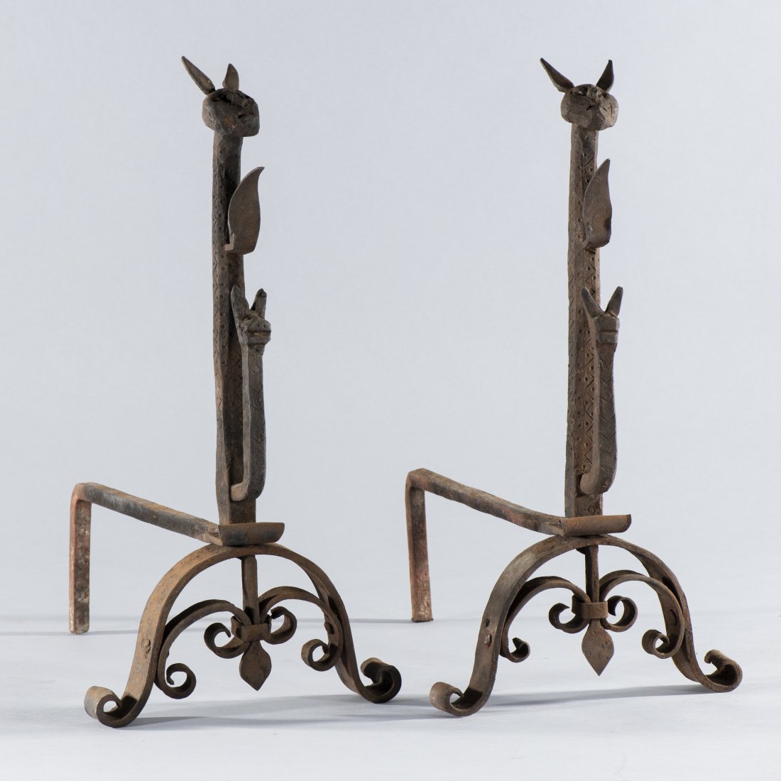 19c. Folk Art Andirons: folk art andirons of a Rabbit, Leaf, and another rabbit on the bottom. Found in the original homeplace in Vance County, NC. A tremendous piece of southern folk art. H 18", L 15", base width is 9" at b