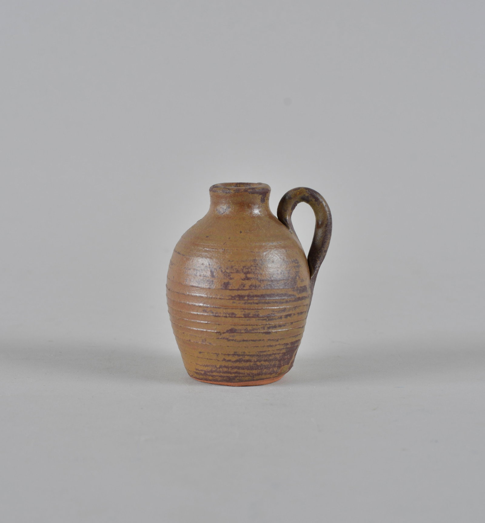 Anita Meaders Miniature jug: very well thrown miniature jug by Anita Meaders signed on bottom. height 3"
