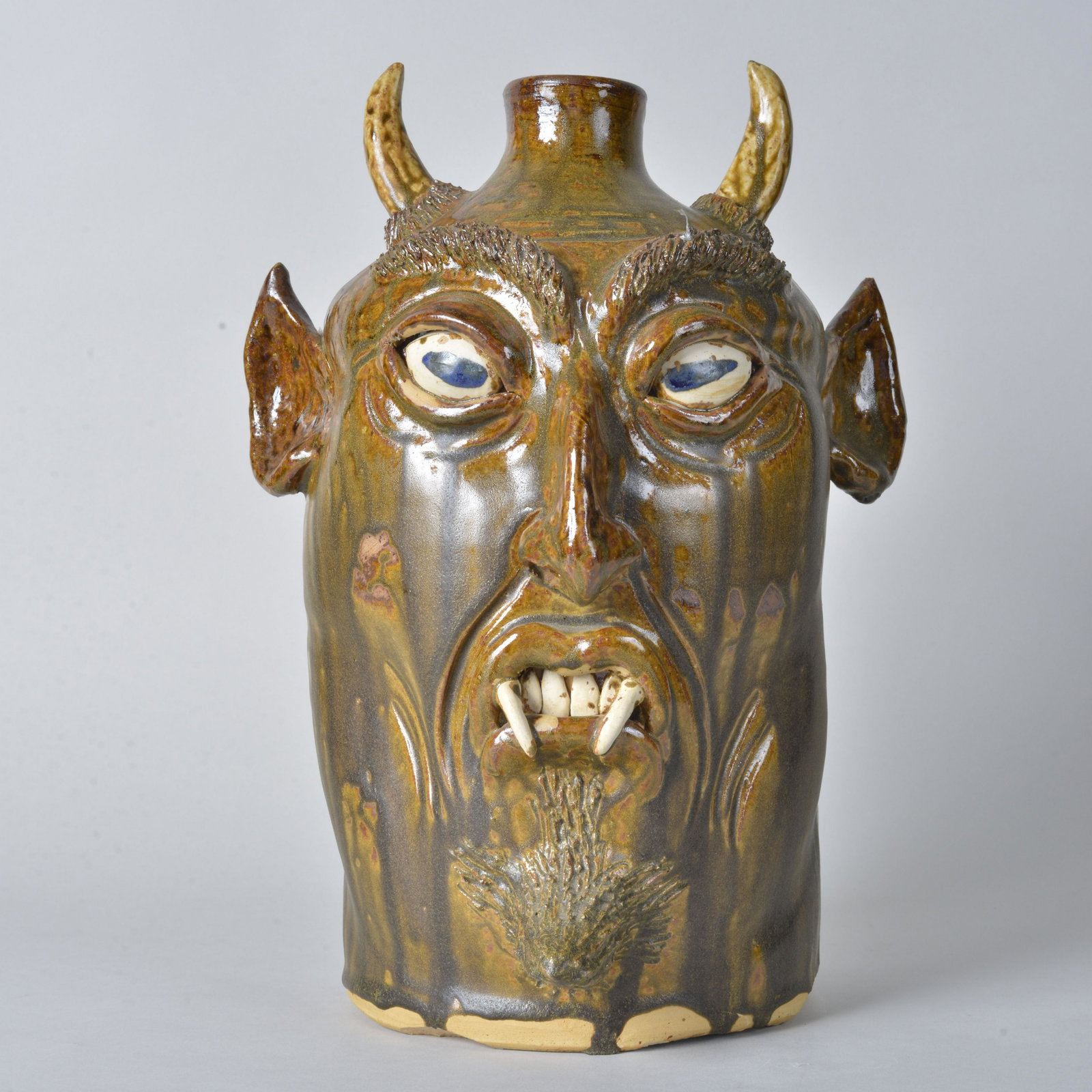 Wilford Dean Devil Face Jug: signed Wilford Dean devil face jug. Great folk art look with sharp teeth and horns. 13" tall