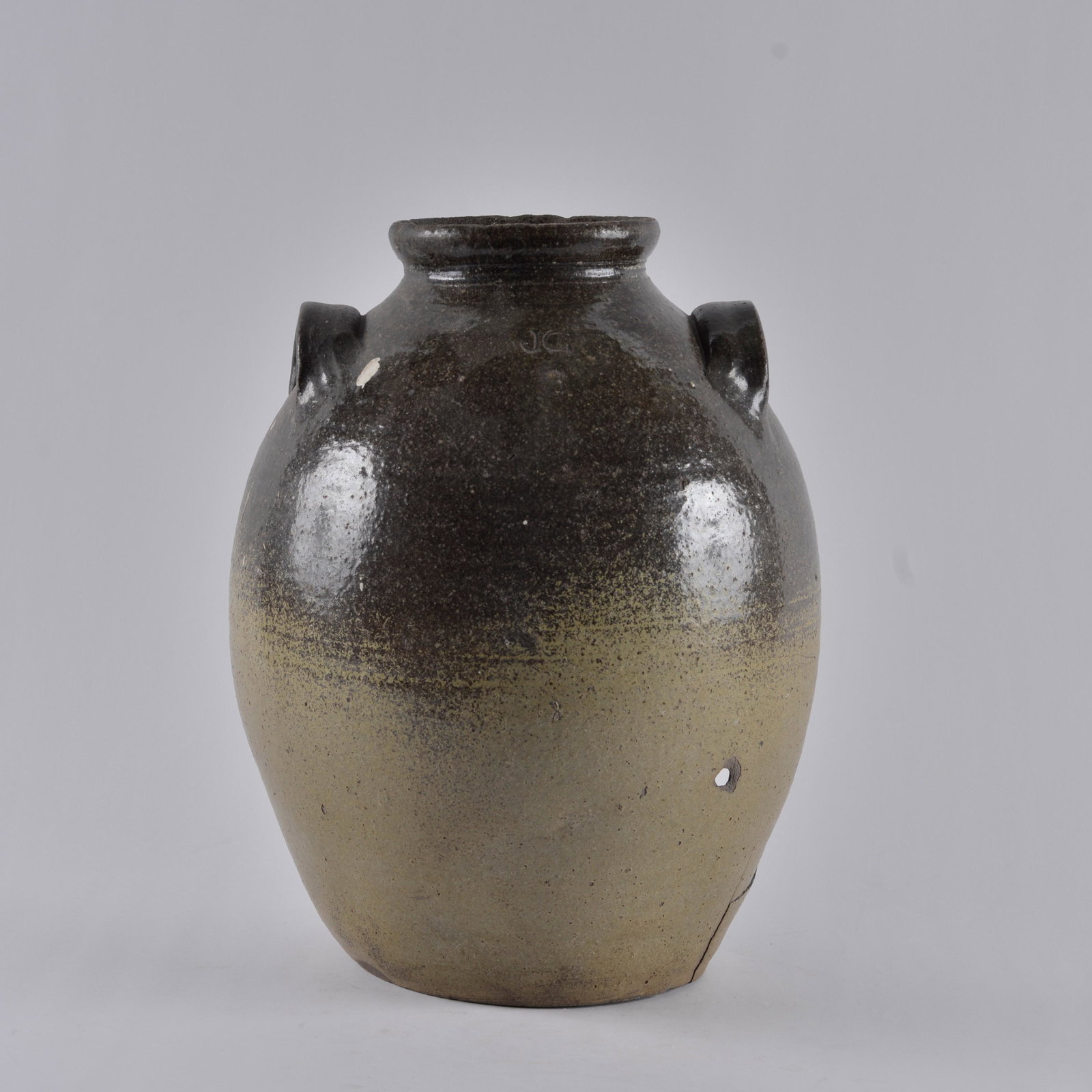 John Goodman signed storage jar: stamped JG for John Goodman. DAMAGE all over. But a great great stamp. Height 14"