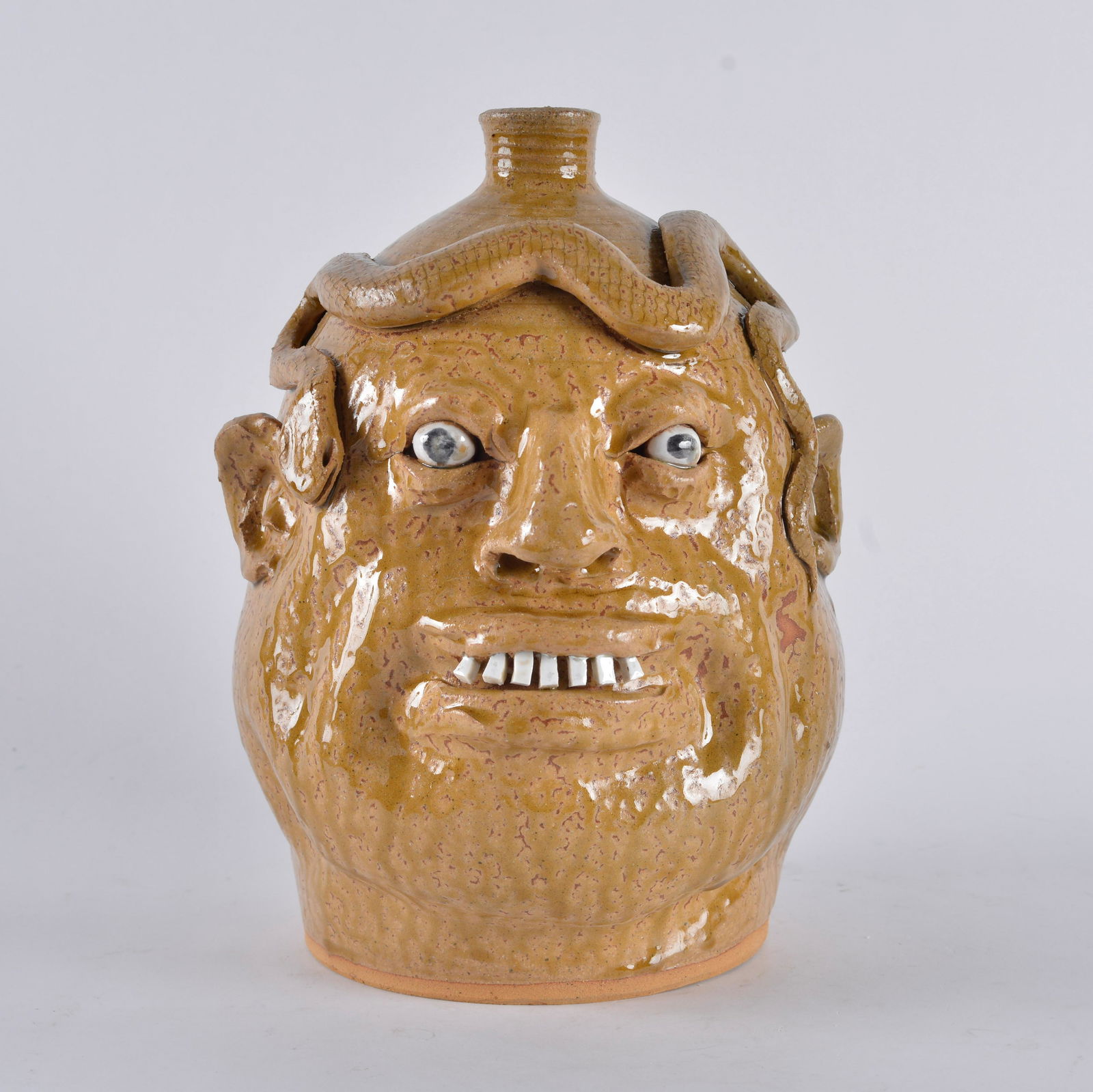Marvin Bailey Snake face jug: fat face jug with a snake on its head. China plate teeth. 11" tall.