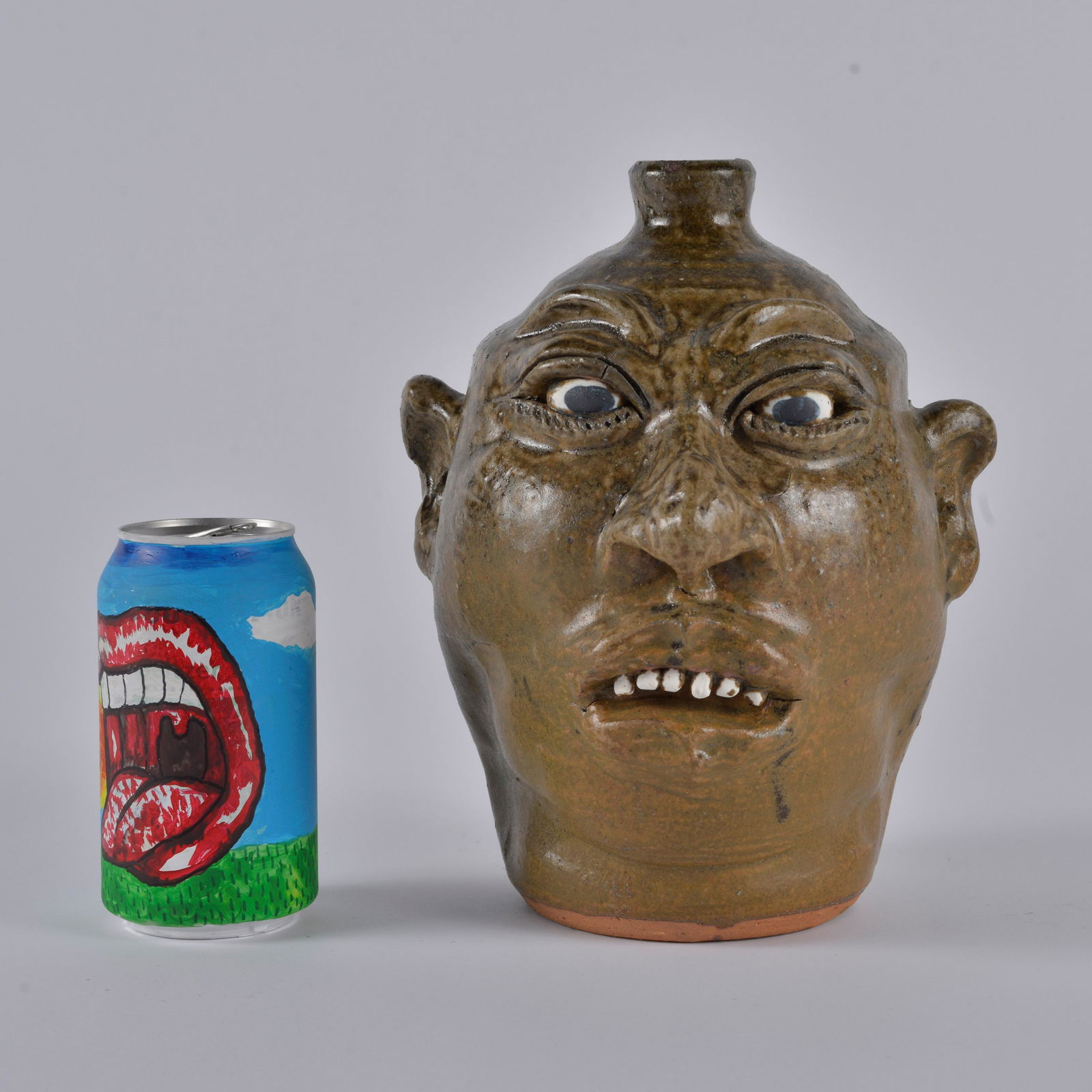 Lanier Meaders African American Face Jug: Lanier Meaders face jug with African American features. Clay teeth. Great facial features and great glaze. A nice size. Height 9" coniditon is excellent.
