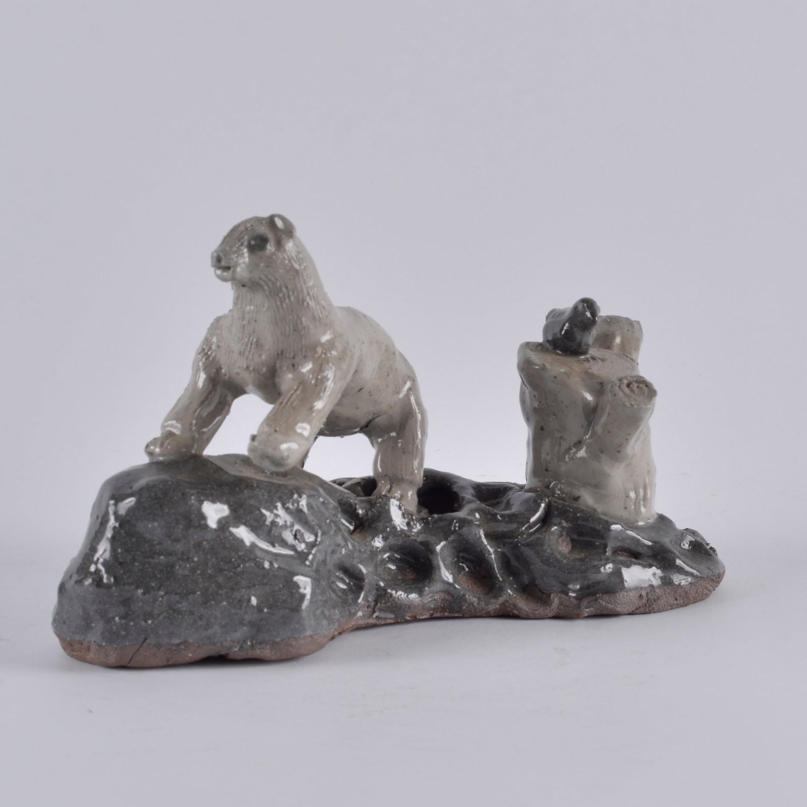 Pauline Crocker Polar Bear Scene: signed PC on the bottom for Pauline Crocker. Polar bear and stump with bird. Length 7"
