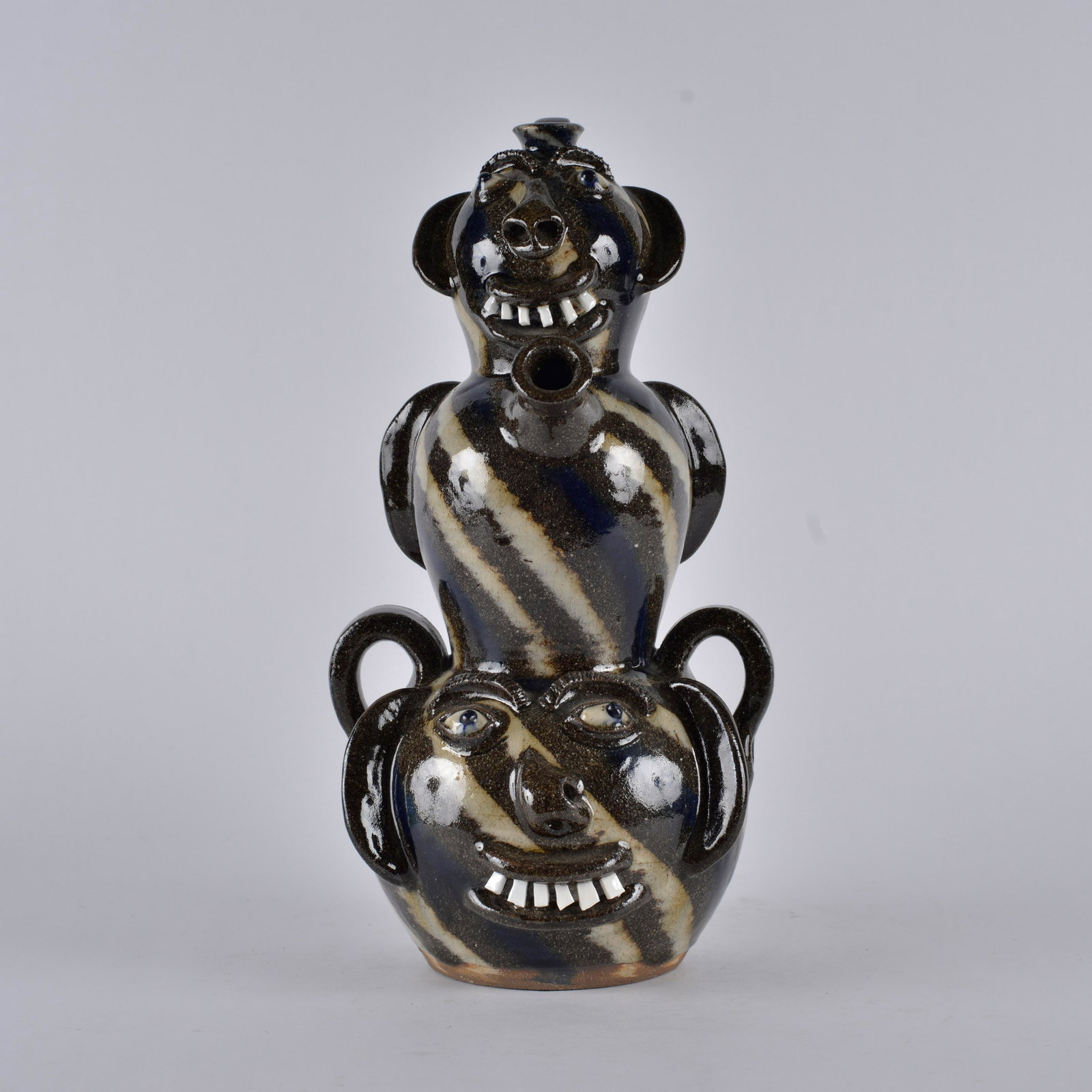 AV Smith Monkey Jug FACE JUG: 3 stack monkey jug form with 3 graduated faces. All having china teeth in the catawba valley swirl technique. Height 14.5"